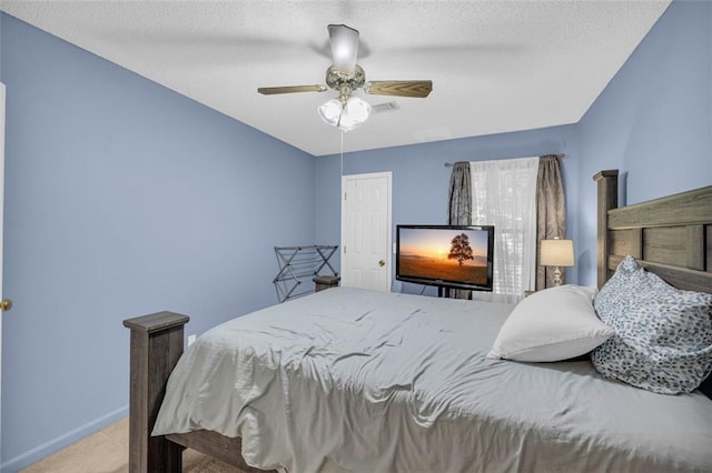6178 Field Stone Dr, Douglasville, GA 30134 - bedroom with carpet, ceiling fan, and a textured ceiling