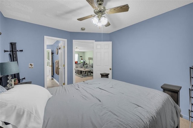 6178 Field Stone Dr, Douglasville, GA 30134 - bedroom featuring a ceiling fan, light carpet, and a textured ceiling