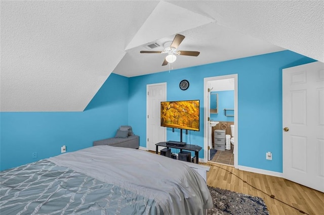 6178 Field Stone Dr, Douglasville, GA 30134 - bedroom with a textured ceiling, wood finished floors, and ceiling fan