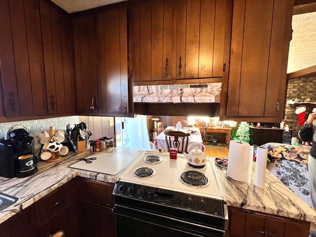 kitchen featuring electric range and light countertops
