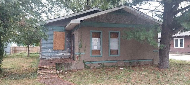 view of home's exterior with fence