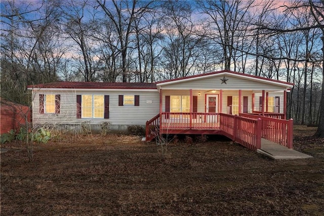 manufactured / mobile home featuring a porch