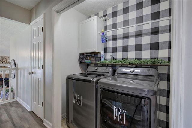 10 Alexandria Ln, Dallas, GA 30132 - laundry room with cabinet space, washing machine and dryer, and wood finished floors