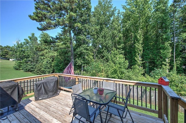 10 Alexandria Ln, Dallas, GA 30132 - wooden deck with a grill and outdoor dining area