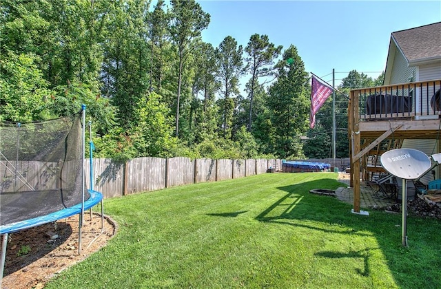10 Alexandria Ln, Dallas, GA 30132 - fenced backyard with a trampoline, a deck, and a swimming pool