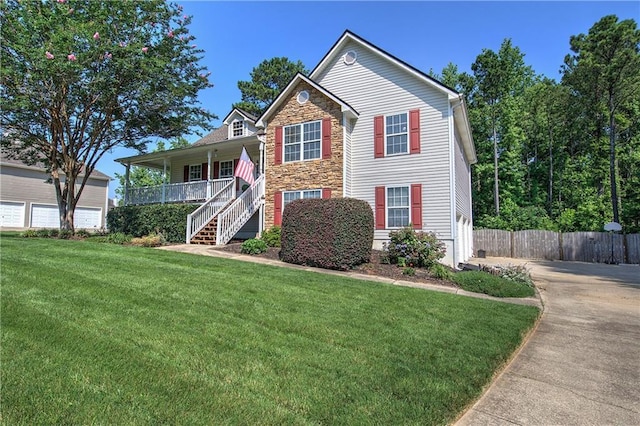10 Alexandria Ln, Dallas, GA 30132 - traditional home featuring stone siding, a porch, and stairs