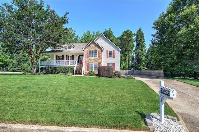 10 Alexandria Ln, Dallas, GA 30132 - view of front facade featuring covered porch, driveway, stairway, and stone siding