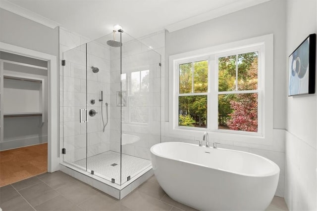 bathroom with independent shower and bath, tile patterned floors, and crown molding