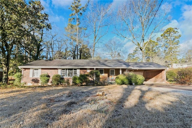 single story home featuring a carport