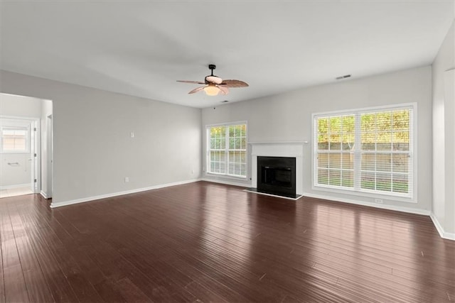 911 Queensbrooke Way, Mableton, GA 30126 - unfurnished living room with a ceiling fan, wood finished floors, baseboards, and a fireplace