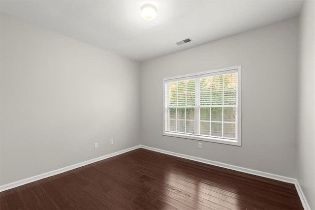 spare room featuring hardwood / wood-style flooring