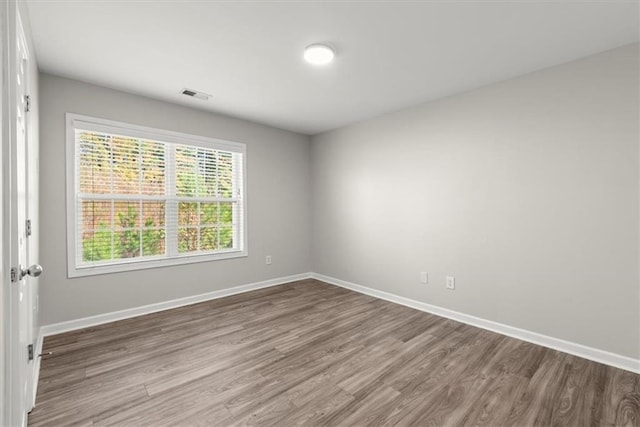 empty room featuring hardwood / wood-style flooring