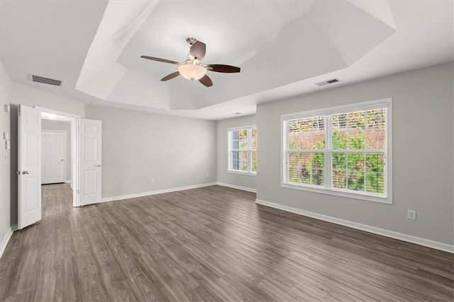 911 Queensbrooke Way, Mableton, GA 30126 - unfurnished room with a raised ceiling, ceiling fan, dark wood-style flooring, and baseboards