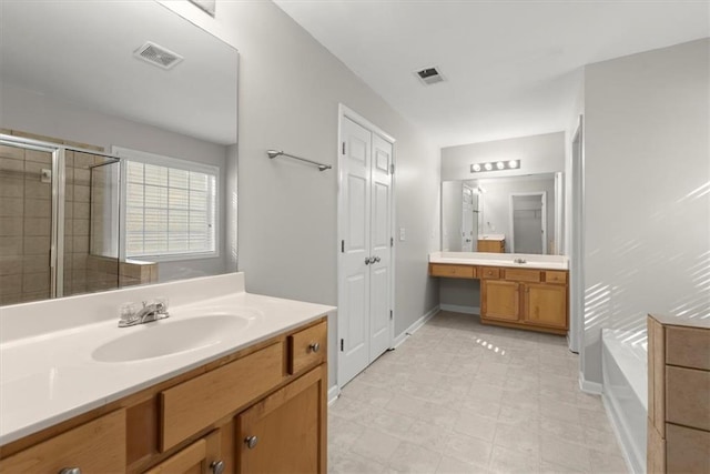 911 Queensbrooke Way, Mableton, GA 30126 - full bath with vanity, a bath, a shower stall, and baseboards
