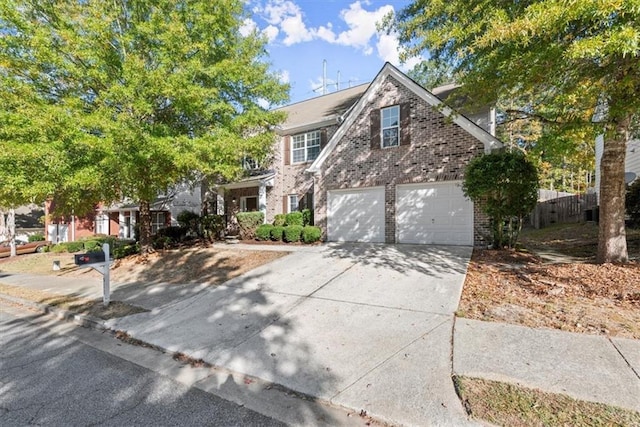 911 Queensbrooke Way, Mableton, GA 30126 - view of front of home with brick siding, concrete driveway, and an attached garage