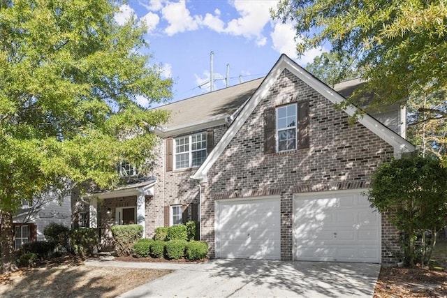 911 Queensbrooke Way, Mableton, GA 30126 - traditional-style house with brick siding, concrete driveway, and an attached garage
