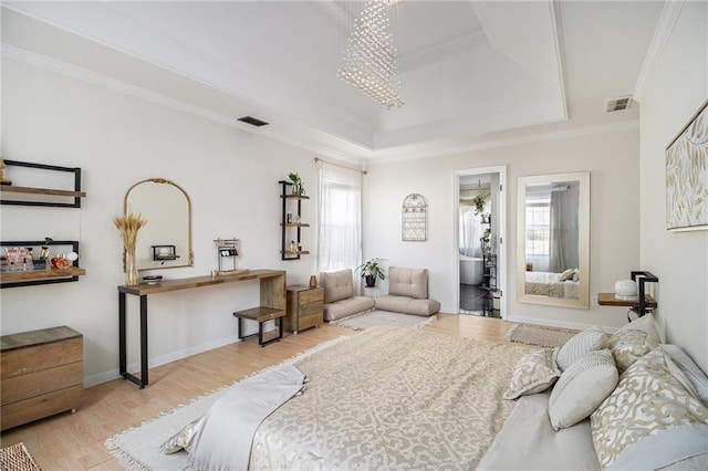 bedroom featuring multiple windows, visible vents, and ornamental molding