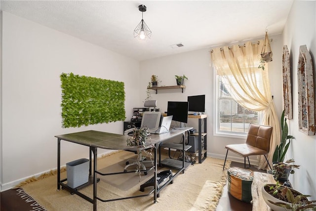 office featuring visible vents and baseboards