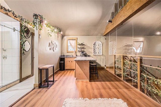 interior space featuring light wood-type flooring and baseboards