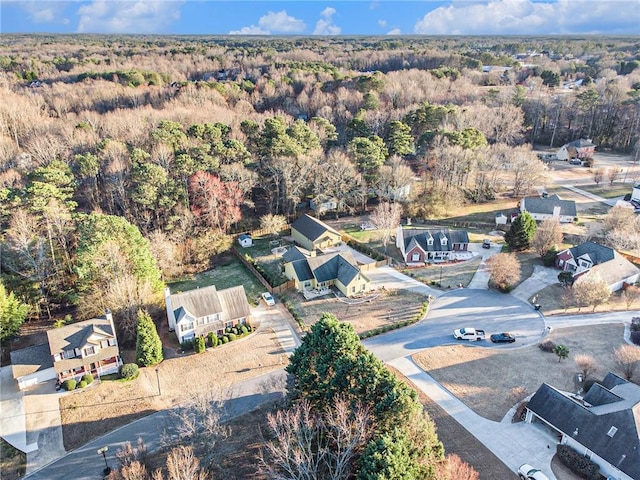 bird's eye view with a forest view