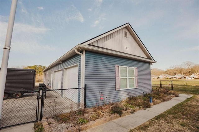 view of side of property with an outbuilding and a garage