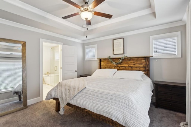 bedroom with a tray ceiling, multiple windows, ceiling fan, and carpet