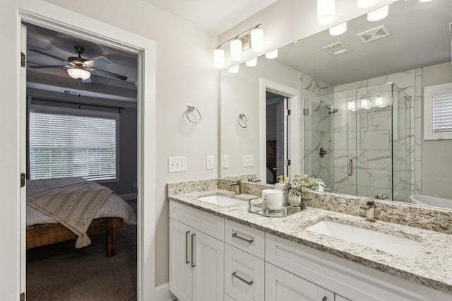 bathroom featuring connected bathroom, visible vents, and a sink