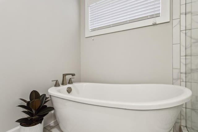 full bath featuring a soaking tub