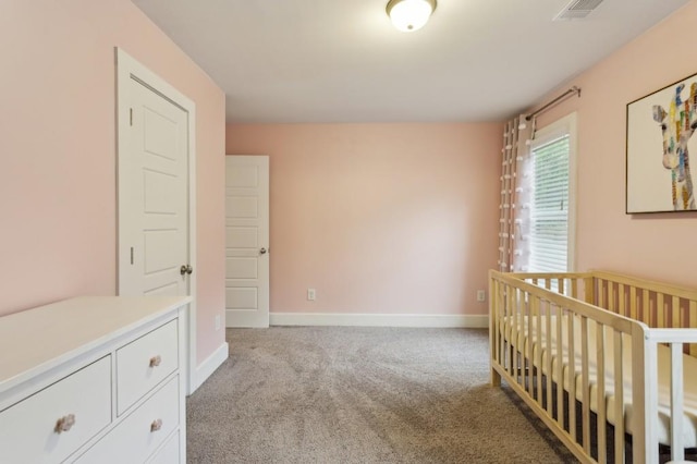 bedroom featuring carpet floors, baseboards, and visible vents