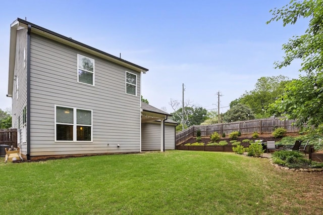 rear view of house with a yard, fence, and central air condition unit