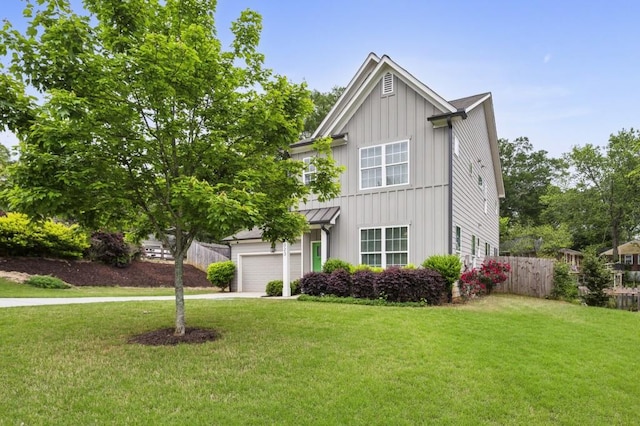 traditional-style home with a garage, a front lawn, board and batten siding, and concrete driveway