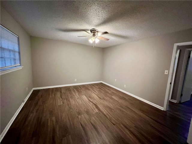 unfurnished room with dark wood-type flooring, ceiling fan, and a textured ceiling