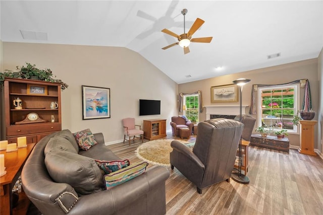 3633 Gilpin Ct, Lawrenceville, GA 30044 - living area with lofted ceiling, light wood-style flooring, a ceiling fan, and baseboards
