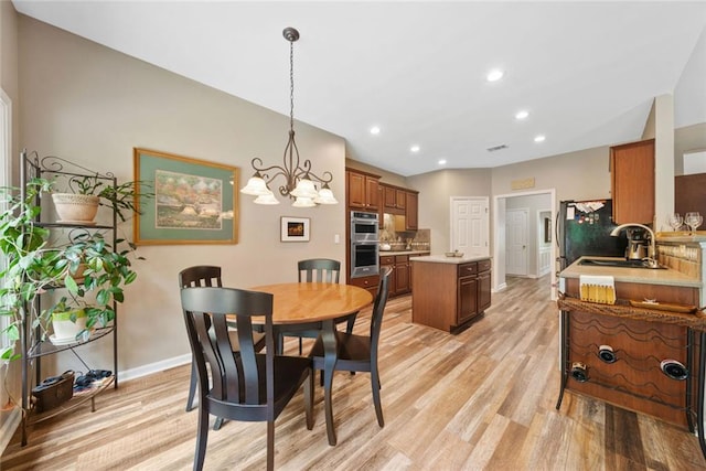 3633 Gilpin Ct, Lawrenceville, GA 30044 - dining space featuring light wood finished floors, baseboards, a chandelier, and recessed lighting