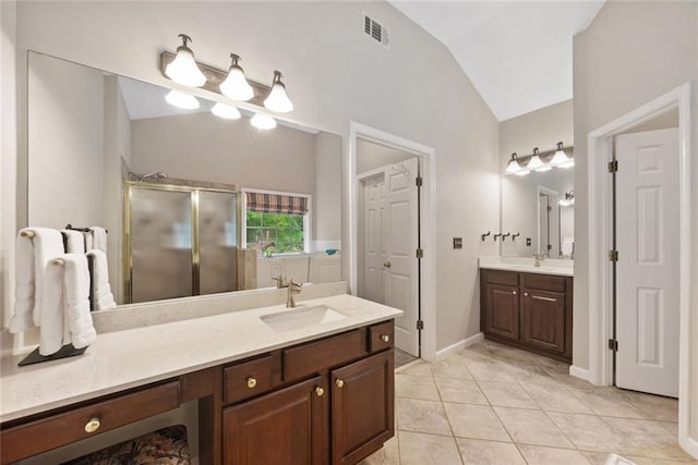3633 Gilpin Ct, Lawrenceville, GA 30044 - full bathroom featuring lofted ceiling, a stall shower, two vanities, tile patterned floors, and baseboards