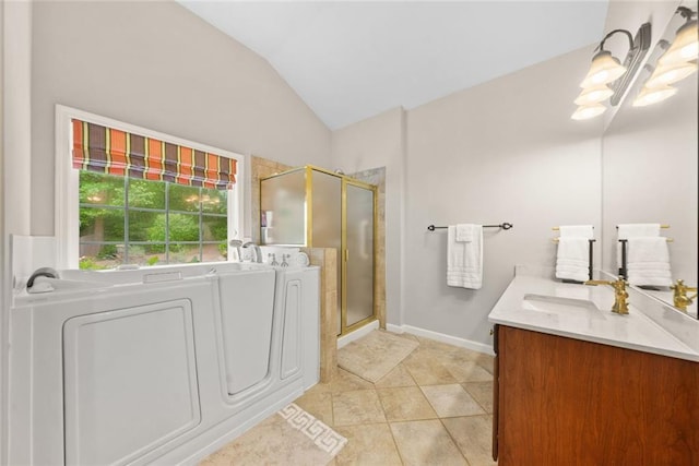 3633 Gilpin Ct, Lawrenceville, GA 30044 - bathroom featuring a shower stall, vaulted ceiling, vanity, a bath, and tile patterned flooring