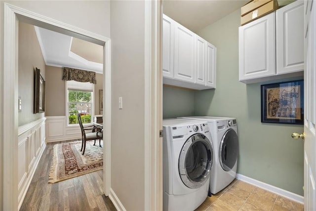 3633 Gilpin Ct, Lawrenceville, GA 30044 - laundry area featuring cabinet space, washing machine and dryer, and baseboards