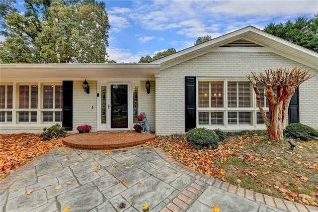 view of front of home with brick siding