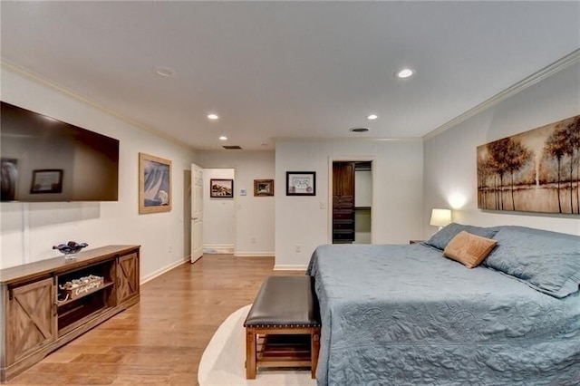 bedroom featuring recessed lighting, visible vents, baseboards, ornamental molding, and light wood-type flooring