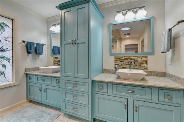 bathroom featuring tasteful backsplash, visible vents, ornamental molding, vanity, and tile patterned flooring