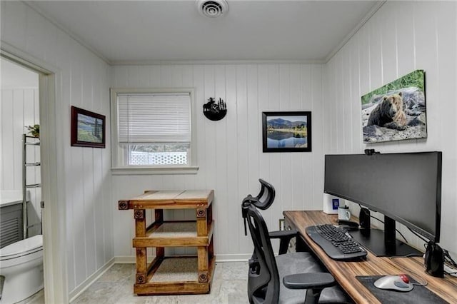 office space with visible vents and baseboards