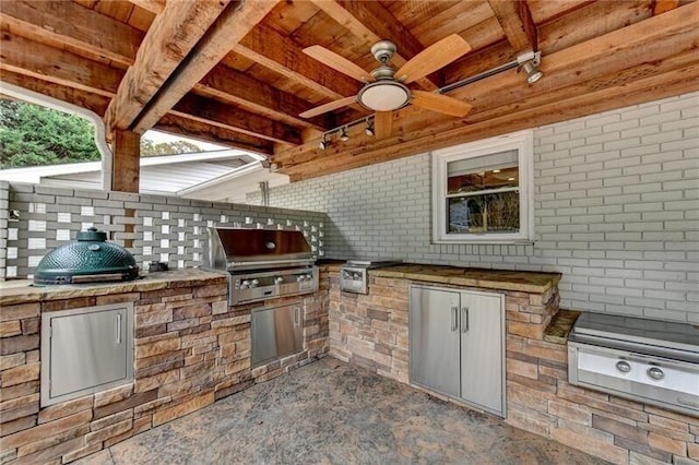 view of patio with grilling area, a ceiling fan, and area for grilling