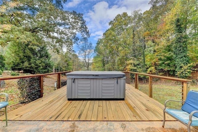 wooden deck featuring a hot tub