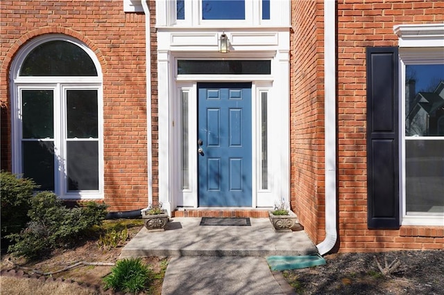 entrance to property with brick siding