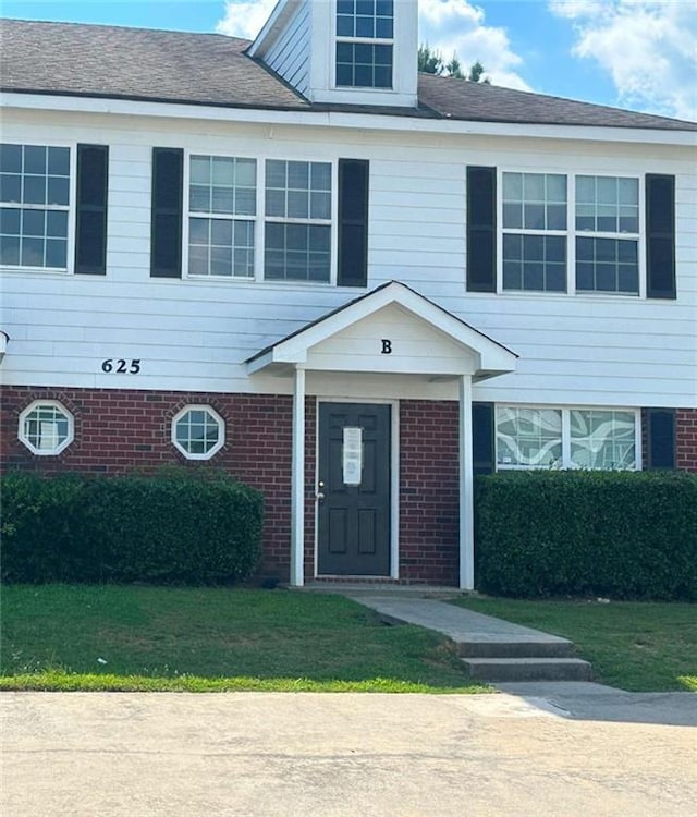 625 Mill Stone Blf Unit B, Monroe, GA 30655 - view of front of home with brick siding and a front lawn