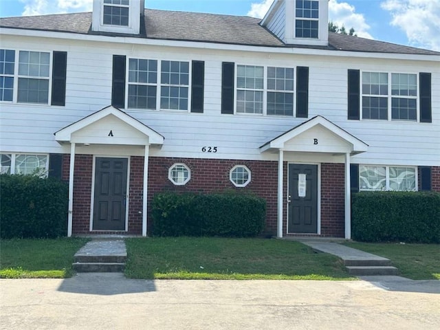 625 Mill Stone Blf Unit B, Monroe, GA 30655 - view of property with brick siding and a front lawn
