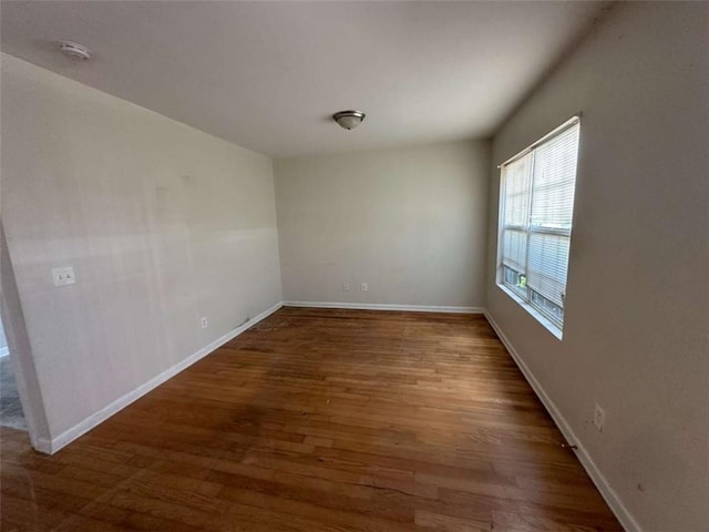 625 Mill Stone Blf Unit B, Monroe, GA 30655 - spare room with wood finished floors and a smoke detector