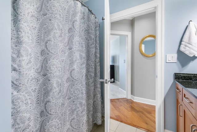 bathroom with tile patterned flooring and vanity