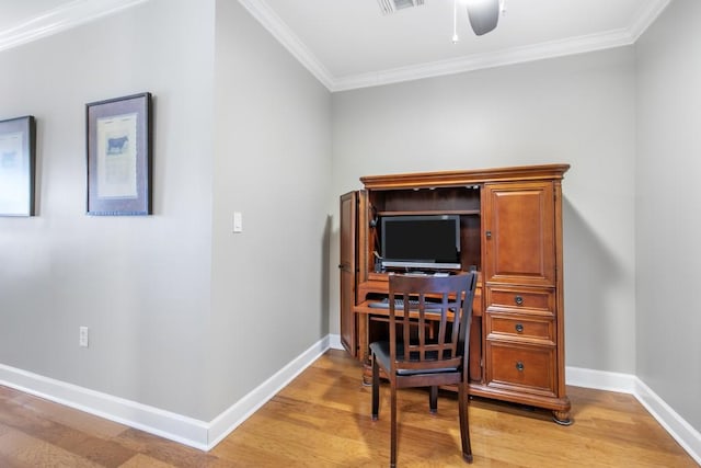 home office featuring crown molding, ceiling fan, and light hardwood / wood-style flooring