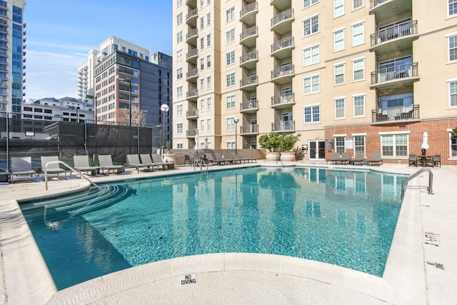 view of pool featuring a patio area